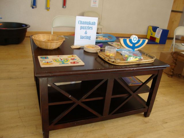 Chanukah Puzzles and Lacing Station for young children at Carnival