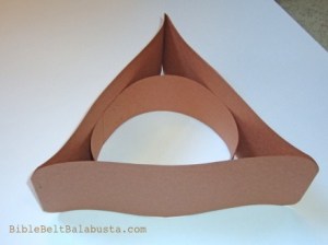and staple headband inside circle.  Attach tissue to inside of triangle.