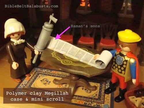 Arrow marks the page listing Haman's ten sons. Megillah readers must chant all ten in one breath.