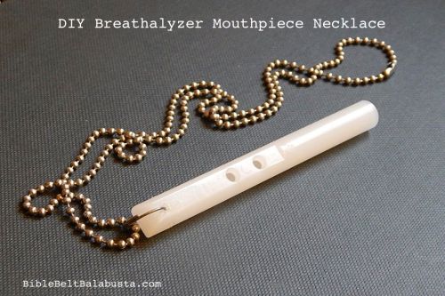 punch a hole on the other side, add a ring and ball chain.