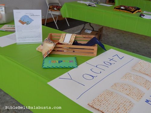 Yachatz step, w/ afikomen covers. Every kid broke the middle matzah and hid the afikomen